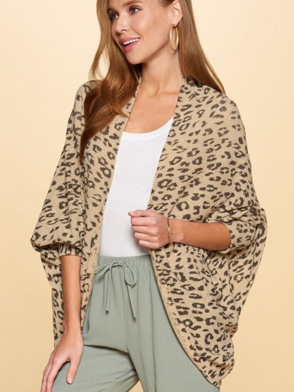 Leopard printed open-cardigan featuring 3/4 length dolman sleeves